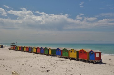 View of the brightly colored Victorian beach cabin houses on the Muizenberg Beach in Cape Town