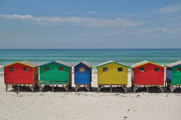 Obraz na płótnie Canvas View of the brightly colored Victorian beach cabin houses on the Muizenberg Beach in Cape Town