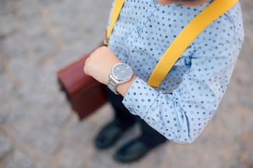 Silver watch close-up on future businessman hand