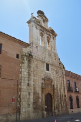 Beautiful Front Facade Of The Church Of Alcala De Henares University With A Nest Of Storks In Its Old Bell Tower. Architecture Travel History. May 5, 2018. Alcala De Henares Madrid Spain.