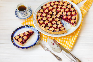 Fototapeta na wymiar slice of delicious homemade sour cherry pie on plate.