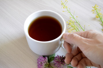 Cup of tea in hand