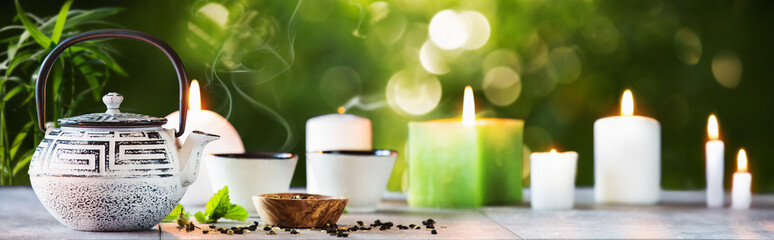 Tea Time on a Natural Background. White Iron Asian Teapot With Green Mint Leaves