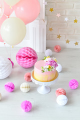Cake for birthday party. Decorations for holiday party. A lot of balloons. 