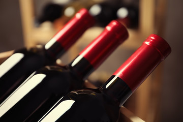 Bottles with delicious wine, closeup. Professional sommelier