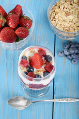 top view mixed berry parfait with spoon