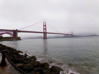 San Francisco Golden Gate Bridge  disappearing in the fog