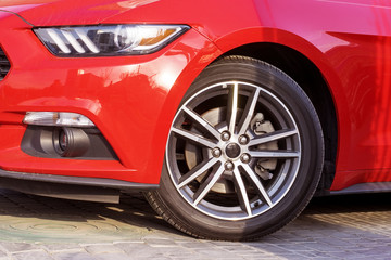 Fototapeta na wymiar .The wheel of a red sports car