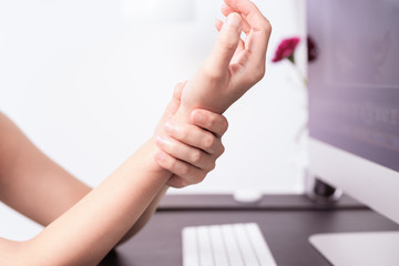woman wrist arm pain long use mouse at office. office syndrome healthcare and medicine concept