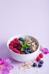 Smoothie bowl with yogurt, fresh berries and cereal