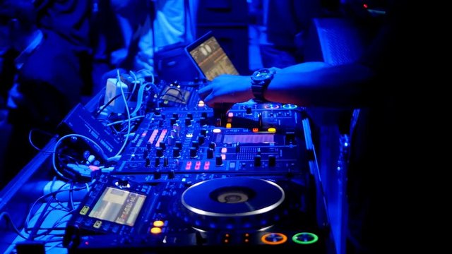 cool dj behind the turntables
