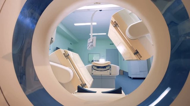 CAT scanner, tomographic machine in action.
