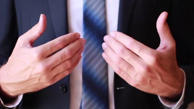 Man standing and gesticulating