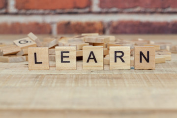 close up of word learn on wood block