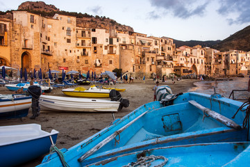 Fototapeta na wymiar Cefalu during sunset, boats and beach, Sicily