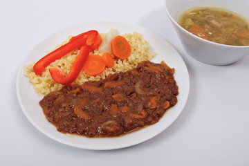 Azuki with vegetables on steam and bulgur on a white