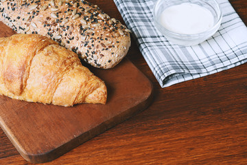 Various types of bread with dip of cream cheese