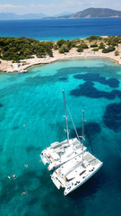 Aerial drone bird's eye photo of tropical paradise island beach with emerald crystal clear waters