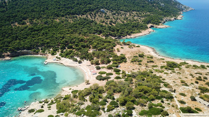 Aerial drone bird's eye photo of tropical paradise island beach with emerald crystal clear waters