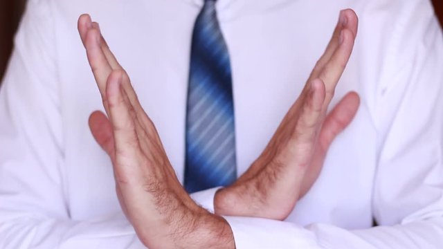 Male crossed hands close up