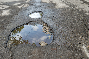 Large potholes filled with water in Montreal