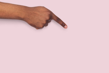 Male hand pointing on object with index finger