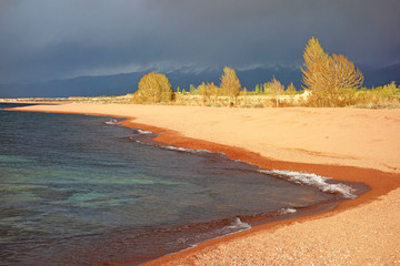 Beautiful shore of  Issyk-Kul lake in the summer day, Kyrgyzstan.
