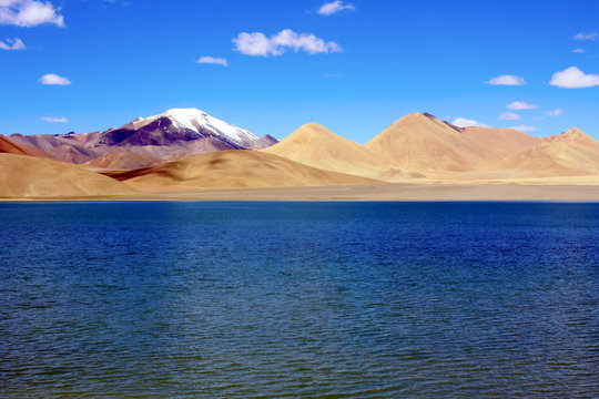 wild mountain lake with deep waters of many shades of blue; Tso Nyak (Pangong Tso), the Tibetan Plateau, China