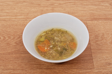 Miso vegetable soup with vegetables on a table