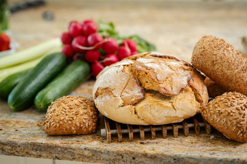 fragrant crunchy bread on the table with fresh and colorful vegetables