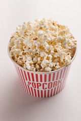 Bucket of popcorn on white background