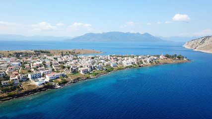 Fototapeta na wymiar Aerial drone bird's eye view photo of port and traditional fishing village of Perdika in island of Aigina, Saronic Gulf, Greece
