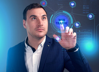 Business, Technology, Internet and network concept. Young businessman working on a virtual screen of the future and sees the inscription: Web traffic