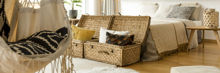 Pillows in straw baskets