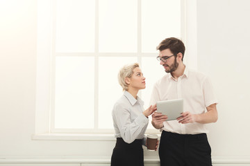 Fototapeta premium Couple of business partners work at modern office