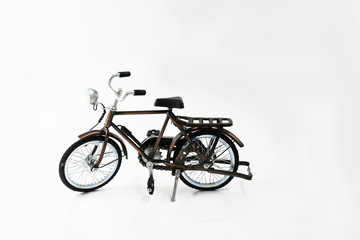 Fototapeta na wymiar vintage bicycle toy on white