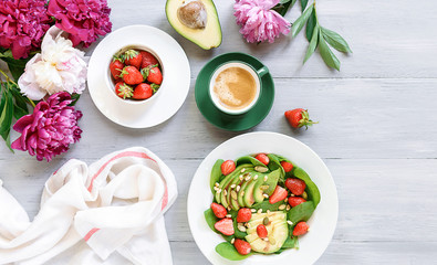 breakfast vegan salad with avocado, strawberries, pine nuts