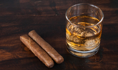 whisky on the rock on wood and wood background