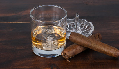 whisky on the rock on wood and wood background