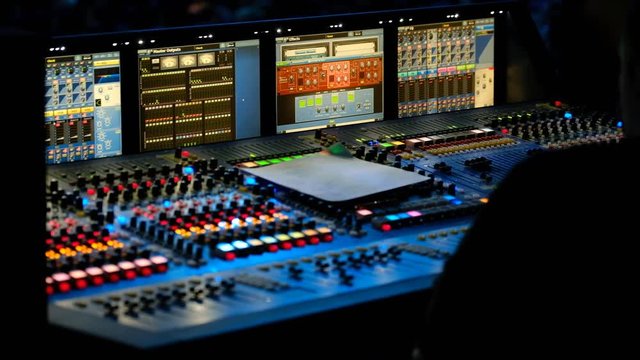 Technical staff is working at the conference, audio and video equipment in progress