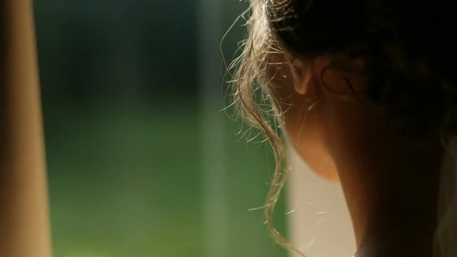 Close up of back of young bride getting ready for wedding ceremony. Bridal morning