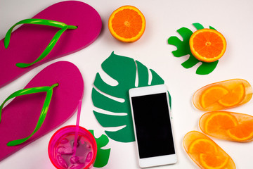 top view summer set with cell phone,flip flops, cold cocktail and orange ice cream,mock up screen