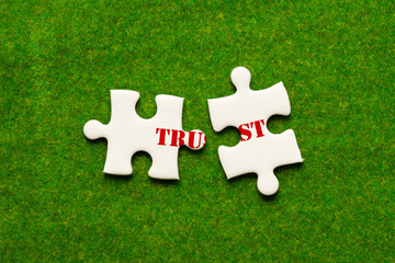 separate two jigsaw puzzle with trust wording