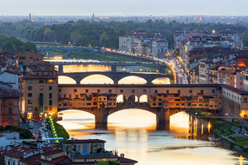 Fototapeta na wymiar Ponte Vecchio bridge over the Arno River in Florence with floodlight