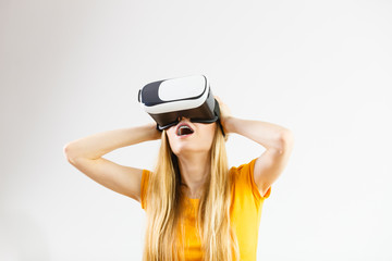 Girl wearing virtual reality goggles.