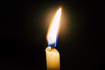 old candle on the black background