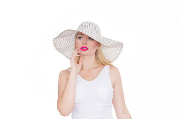 Beautiful young blond woman in a hat. Studio. Isolate. Concept - summer mood