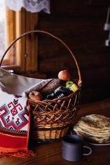 basket with fruits and drinks for a picnic. towel with a pattern