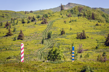 Fototapeta premium Border markes on a Polish-Ukraine boundary, seen from a trail in Bieszczady Mountains National Park, Poland