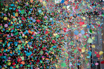 Fototapeta premium confetti falling during a festival or carnival in the city
